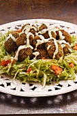 Kibbeh (grain-meat-meatballs on a salad plate)