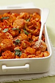 Pasta bake with tomato sauce and chicken burgers