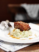Pork belly on a bed of mashed potatoes