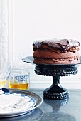 Whole Chocolate Frosted Cake on Cake Stand