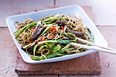 Lamb with spring onions and oriental noodles