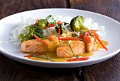 Grilled salmon with coconut sauce, broccoli and rice