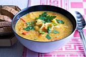 Carrot soup with pasta, pepper and chilli