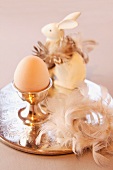 An elegant Easter arrangement featuring an egg and a rabbit