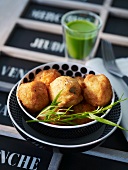 A herb drink with potato croquettes