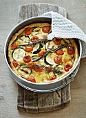 Mushroom quiche with courgettes, cherry tomatoes and rosemary
