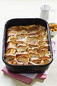 Bread pudding with bananas in a baking tin