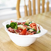 Penne Pasta with Tomatoes, Bacon and Spinach in a Bowl