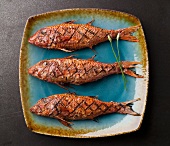 Three Whole Grilled Red Mullet Fish on a Platter