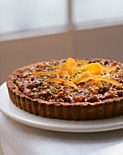 A tart made with dried fruit, nuts and caramel