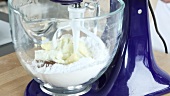 Cream cheese creme being mixed in a food processor