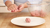 Meat balls being shaped