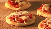 Mini pizzas being baked in a wood-fired oven (time lapse)