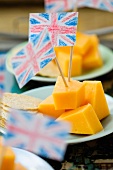 Cheddar cheese on sticks with Union Jacks and crackers