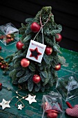 Christmas tree with red apples and Merry Christmas sign