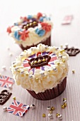 Cupcakes topped with cream and Union Jacks surrounded by chocolate crowns