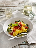 Saffron risotto on a bed of leek with braised tomatoes
