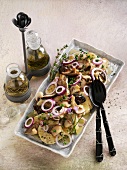 Dumpling salad with mushrooms and onions