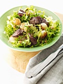 Frissee lettuce with chicken liver and onion