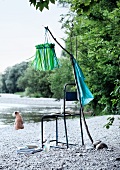 Hand-crafted lantern made from strips of paper on beach