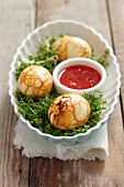 Boiled eggs marinated in tea on a bed of cress (China)
