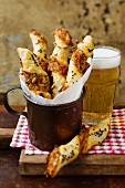 Cheese breadsticks and a glass of beer