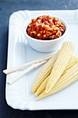 Corn cobs with a tomato dip