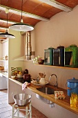 Narrow kitchen counter with integrated sink and hob