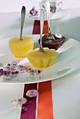 Fruit sorbets on a plate with spoons for sticks