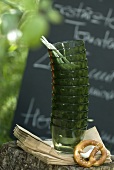 Stacked glasses and pretzel in garden