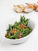 Green bean salad with pine nuts and red onions