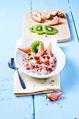 Muesli with fresh strawberries and kiwi