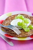 Chocolate pancakes with grapes