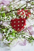 Heart-shaped box amongst flowering branches