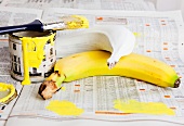 Bananas and a tin of yellow paint
