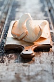 An oyster mushroom on a wooden board