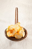 Potato chips on a wooden spoon
