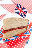 A slice of sponge cake decorated with a Union Jack