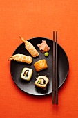 A sushi plate with wasabi and ginger