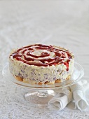 Raspberry ice cream cake on a cake stand