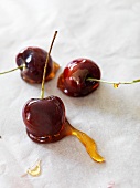 Caramel cherries on a piece of baking paper