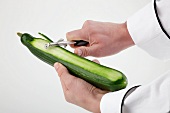 Sushi Chef Peeling a Cucumber