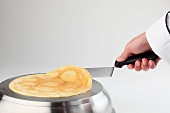 Tossing a pancake