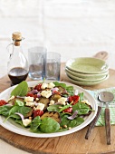 Spinach salad with sweet potatoes and feta cheese