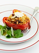 A pepper filled with couscous, pine nuts and raisins