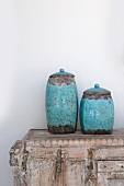 Two earthenware jugs on dresser