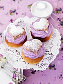 Profiteroles with blueberry cream and icing sugar