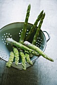 Green asparagus in a colander