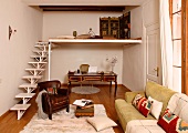 Minimalist staircase leading to mezzanine in living room and leather armchair in lounge area in front of Rococo-style bureau