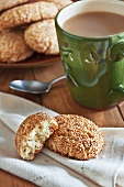 Regina Sesame Cookies on a Linen Napkin with a Cup of Coffee